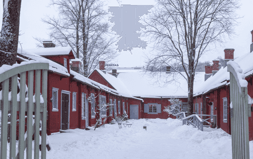 The snowy courtyard of the Pharmacy Museum and the Qwensel House.