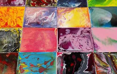 Colorful artworks made using the pouring technique.