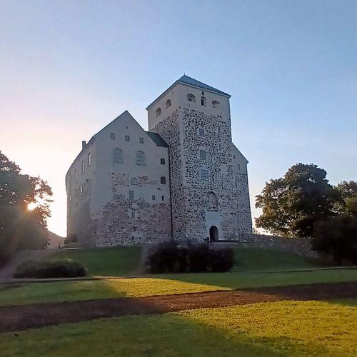 The southern end of Turku Castle. A tall stone building with a tower.