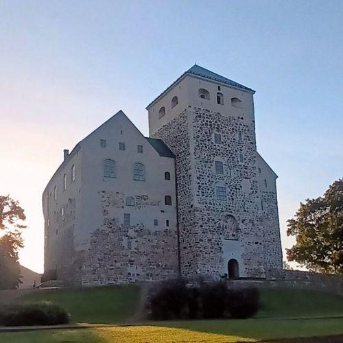 The southern end of Turku Castle. A tall stone building with a tower.