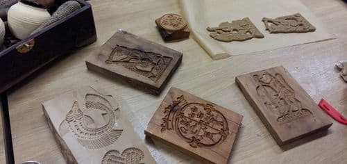 wooden tiles with engraved patterns on the table.
